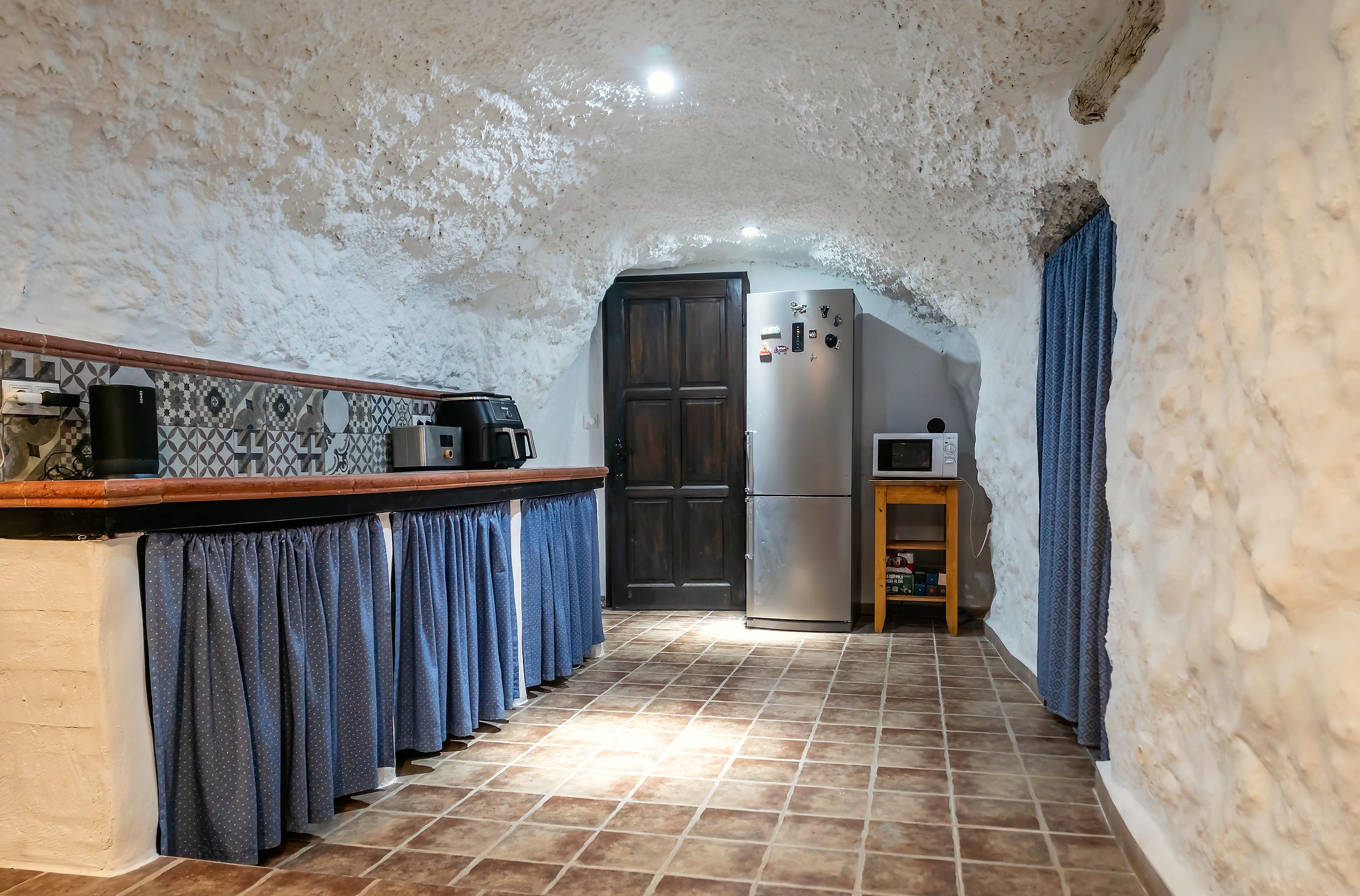 Kitchen appliance area with air fryer, fridge and microwave at Leonard’s Lookout