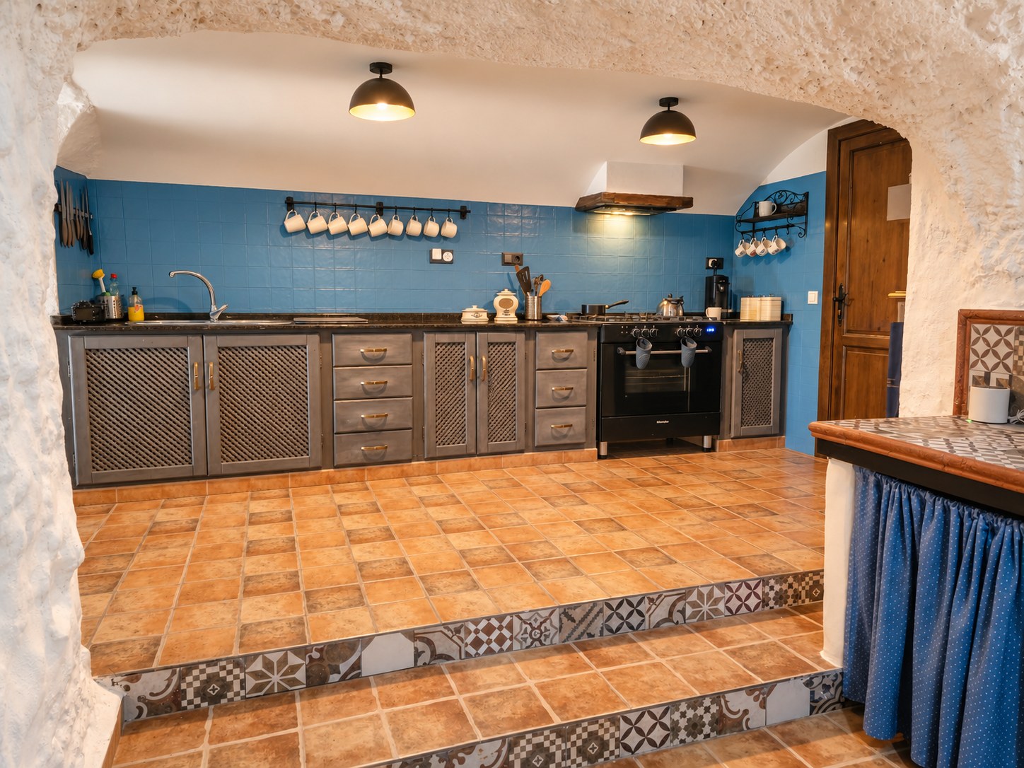 Wide view of the fully equipped cave kitchen at Leonard’s Lookout