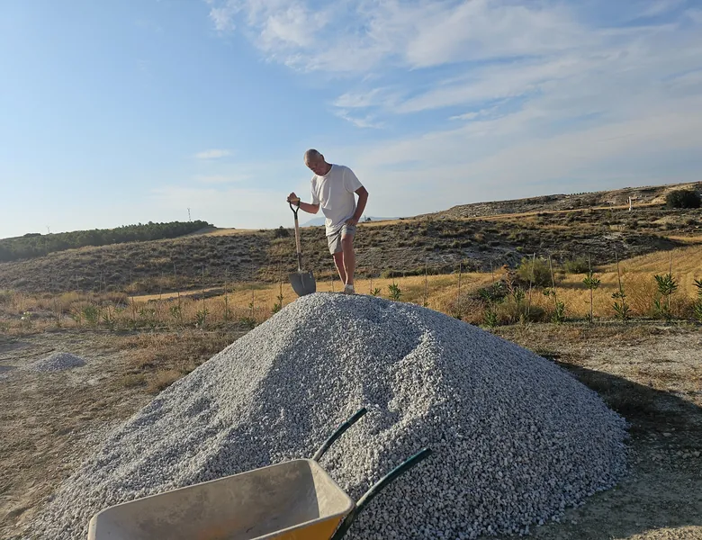 VJ restoring a traditional stone wall at Leonard's Lookout