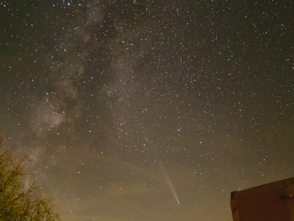 Milky Way and comet above the mountain horizon and Leonard’s Lookout under rural night skies