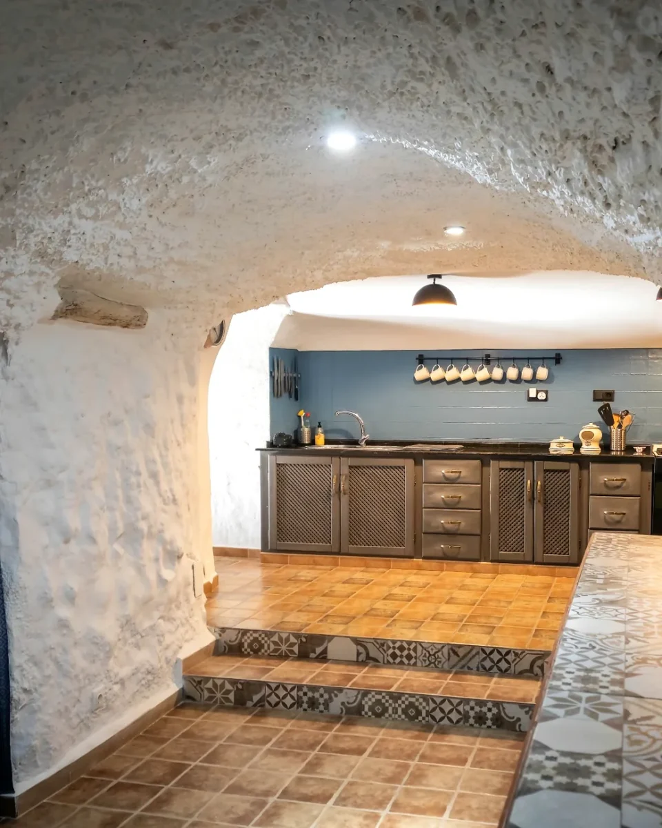 Carved cave kitchen with whitewashed walls at Leonard's Lookout