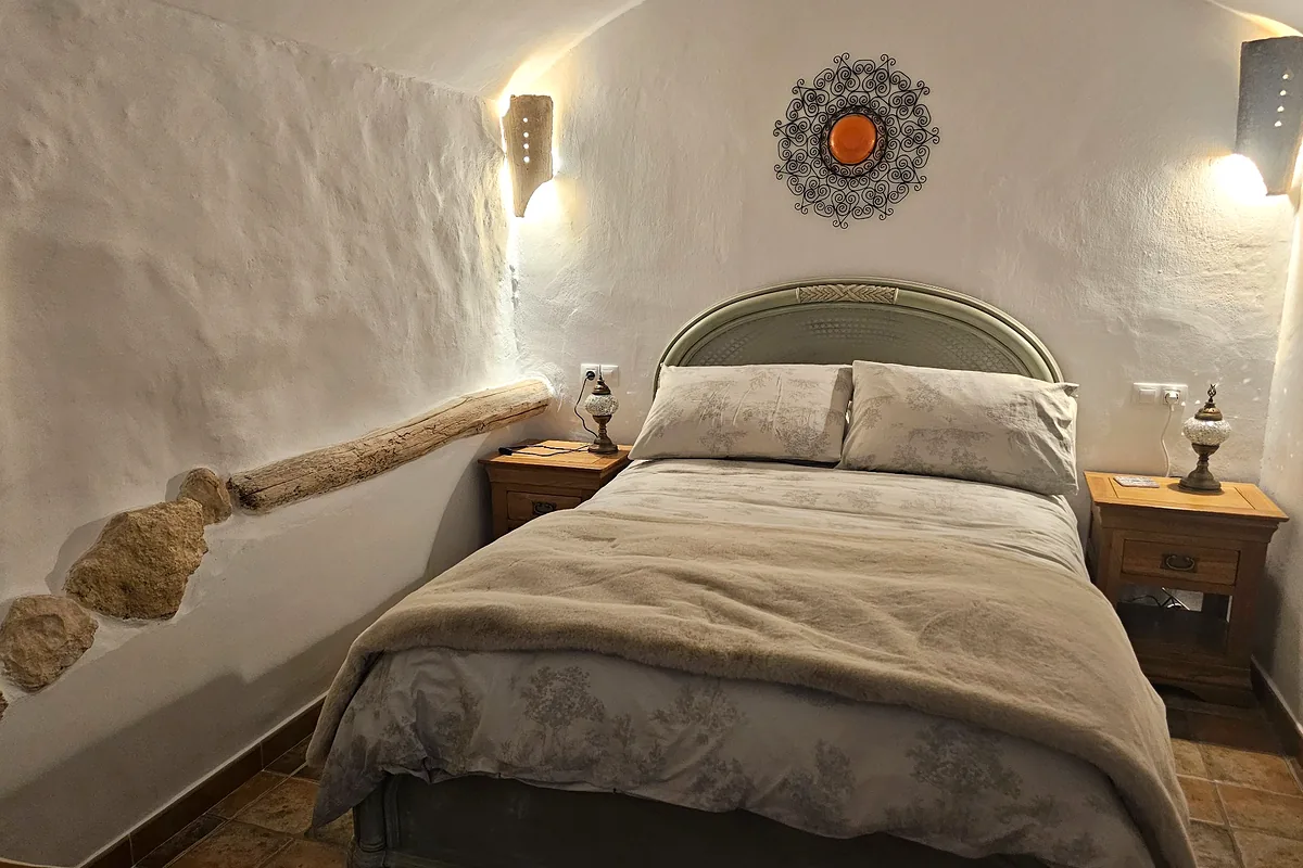Double bedroom built into the cave interior at Leonard’s Lookout