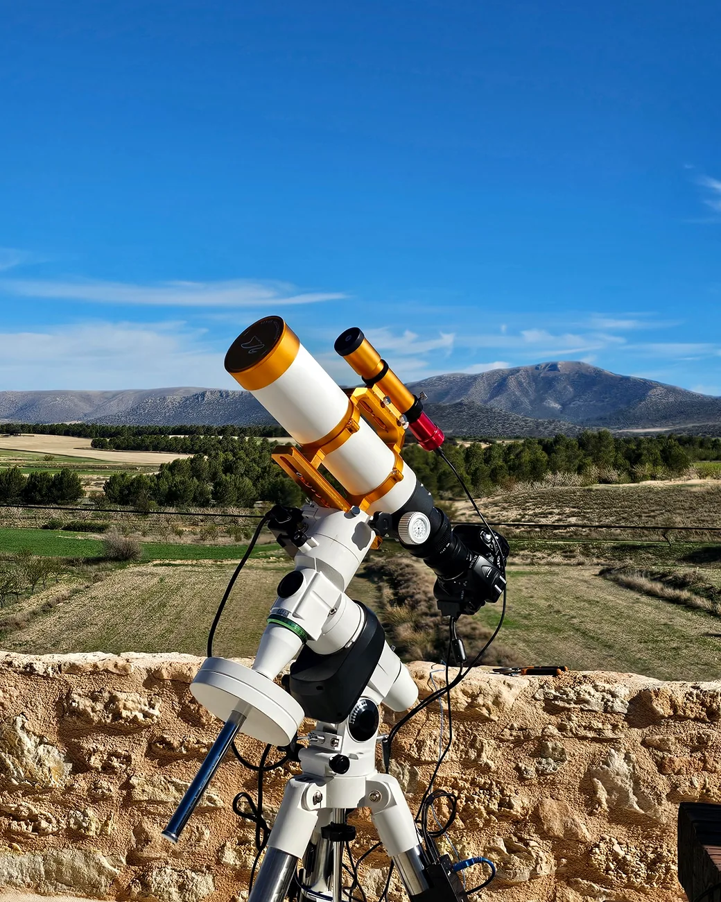 Telescope setup with mountain views at Leonard's Lookout